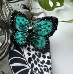 piespraude broša taurenis