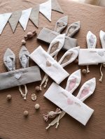 Zaķa maskas bērniem dažādās krāsās – balta, pelēka un rozā, piemērotas karnevālam.